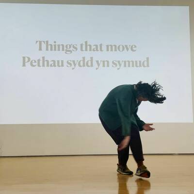 Dancing infront of a message - Things that move/Pethau sydd yn symud.