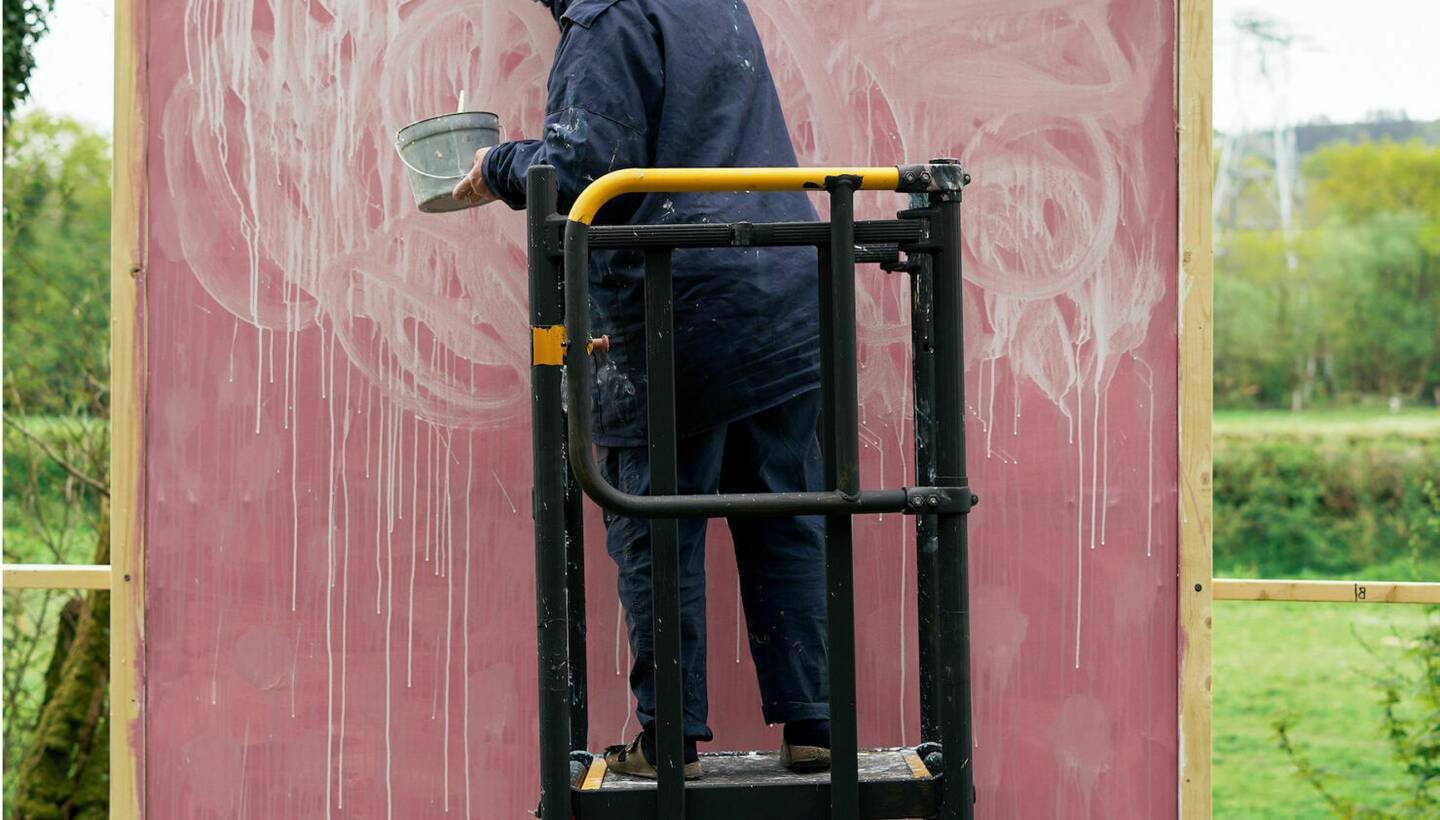 Helen Booth working on a large painting.