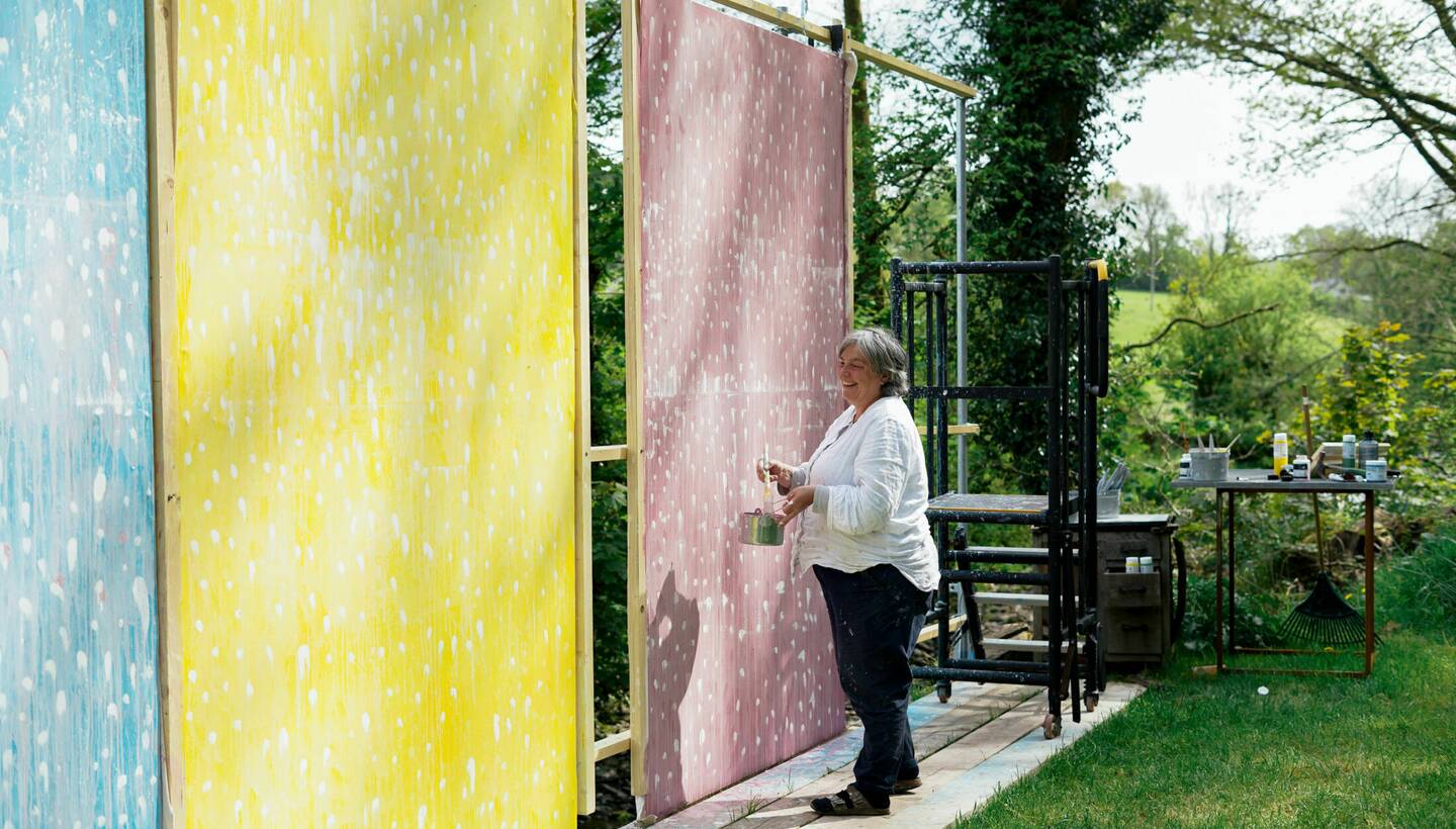 Helen Booth working on her paintings.